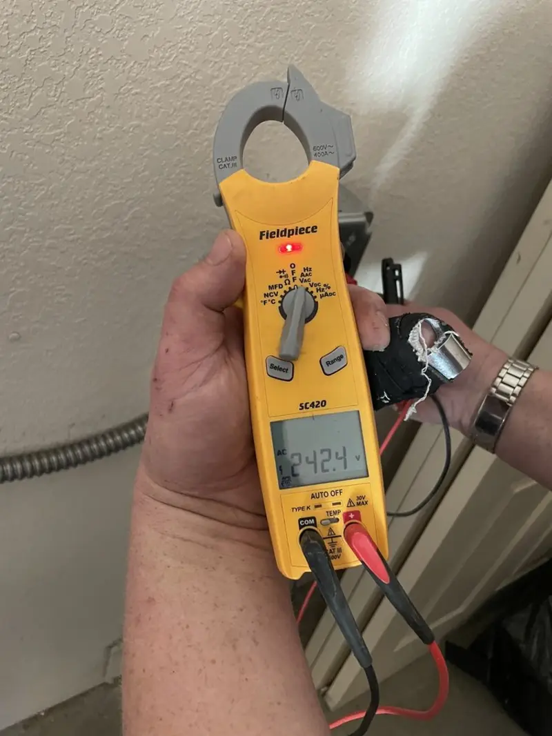Voltage testing with clamp meter during Whole House Surge Protector in Green